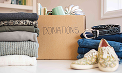 Box of clothes labeled "Donations"